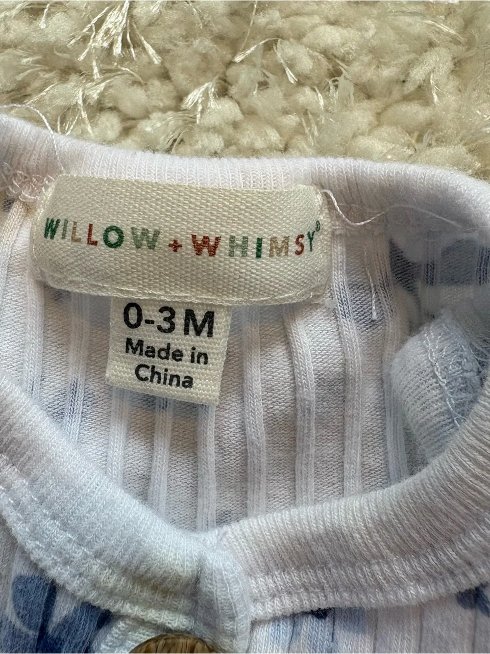 Willow+Whimsey Sleeveless Ribbed One-Piece Bodysuit in White with Blue Floral